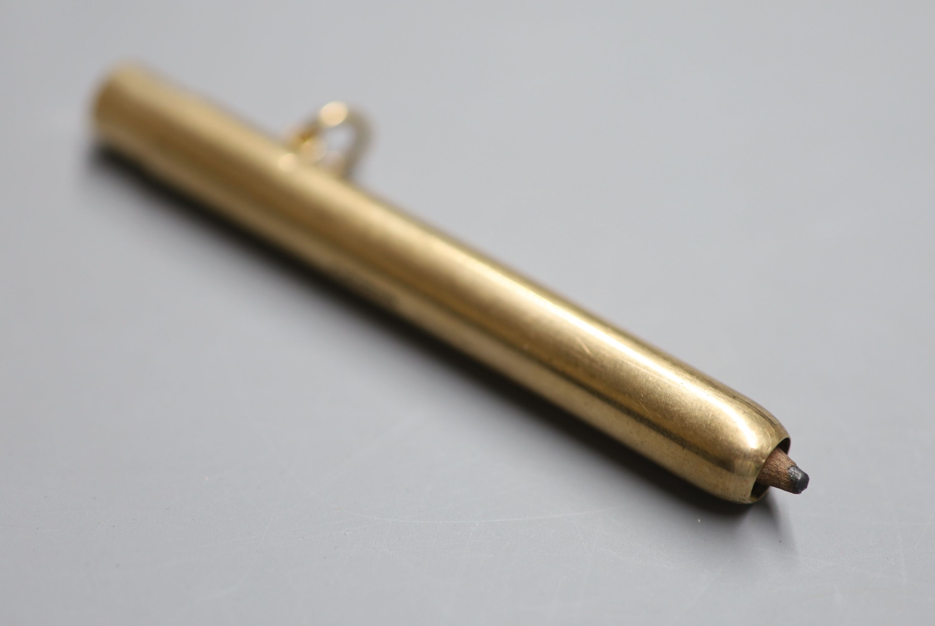 A George V 9ct gold cased pencil by Sampson Mordan & Co, 75mm, gross 18.3 grams.